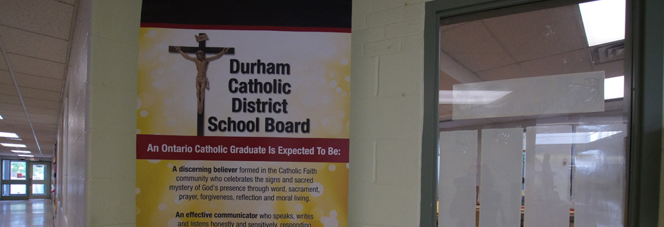 Stand up sign stating the Catholic Graduate Expectations.